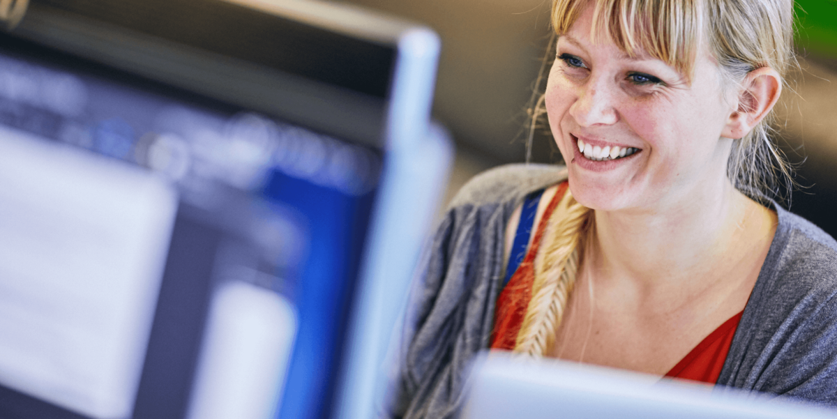 Woman smiling at desk