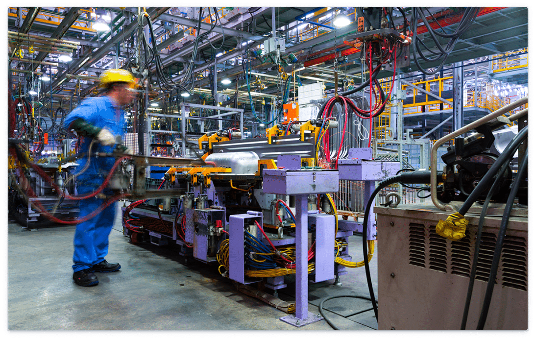 Assembly line worker in a factory.