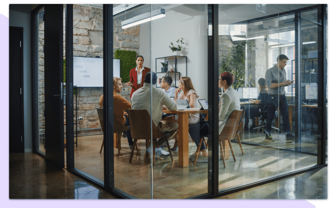 Team meeting in glass meeting room