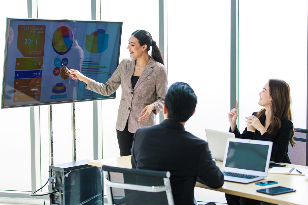 Business woman presenting to coworkers.