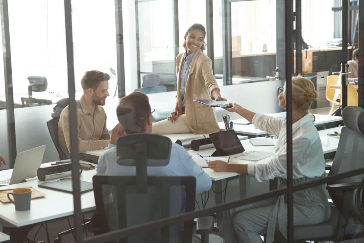 A group of professionals holding a meeting in a conference room.