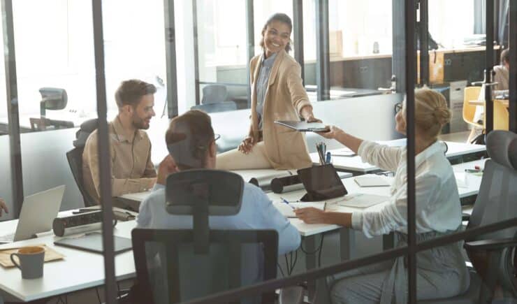 A group of professionals holding a meeting in a conference room.