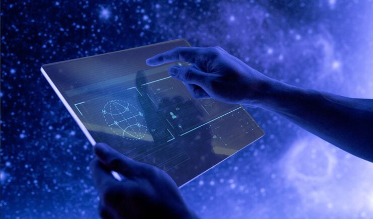 Person holding handheld tablet display with charts over a starry background.