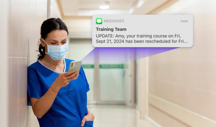 View of an SMS update sent from Administrate to a medical professional informing her of a change in an upcoming training event.