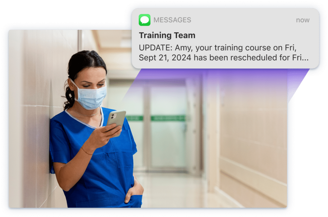 Screenshot of medical professional looking at their phone and reading a notification.