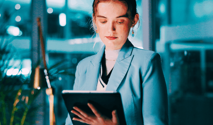 Audit professional reviews a tablet to ensure compliance