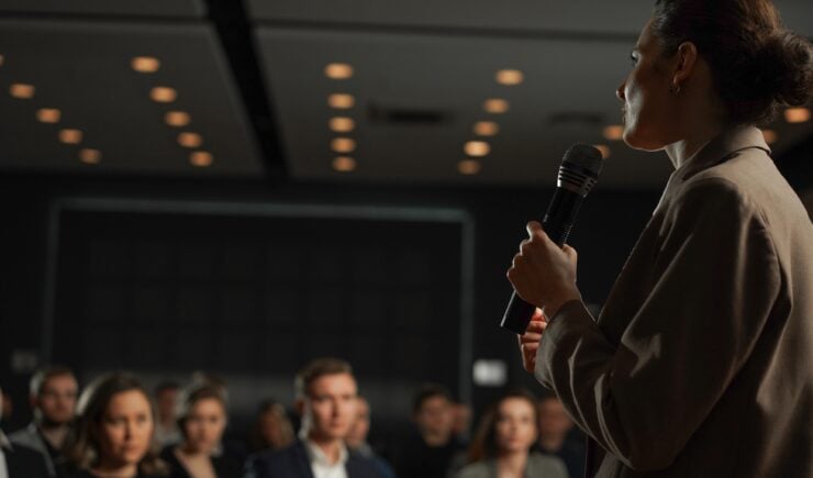 Woman speaking at training for professionals.
